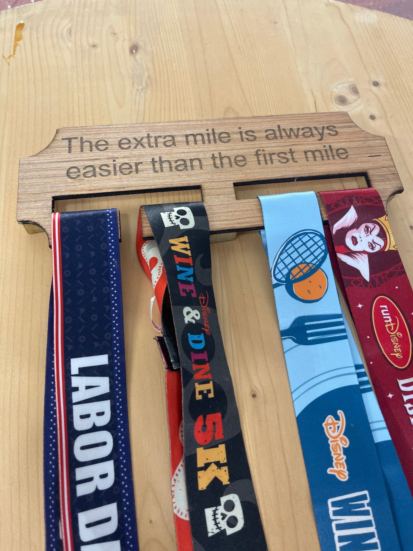 The extra mile wooden race medal hanger/holder