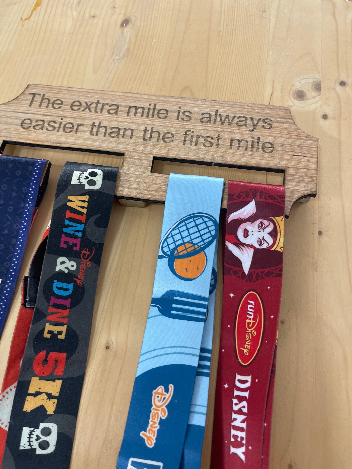 The extra mile wooden race medal hanger/holder