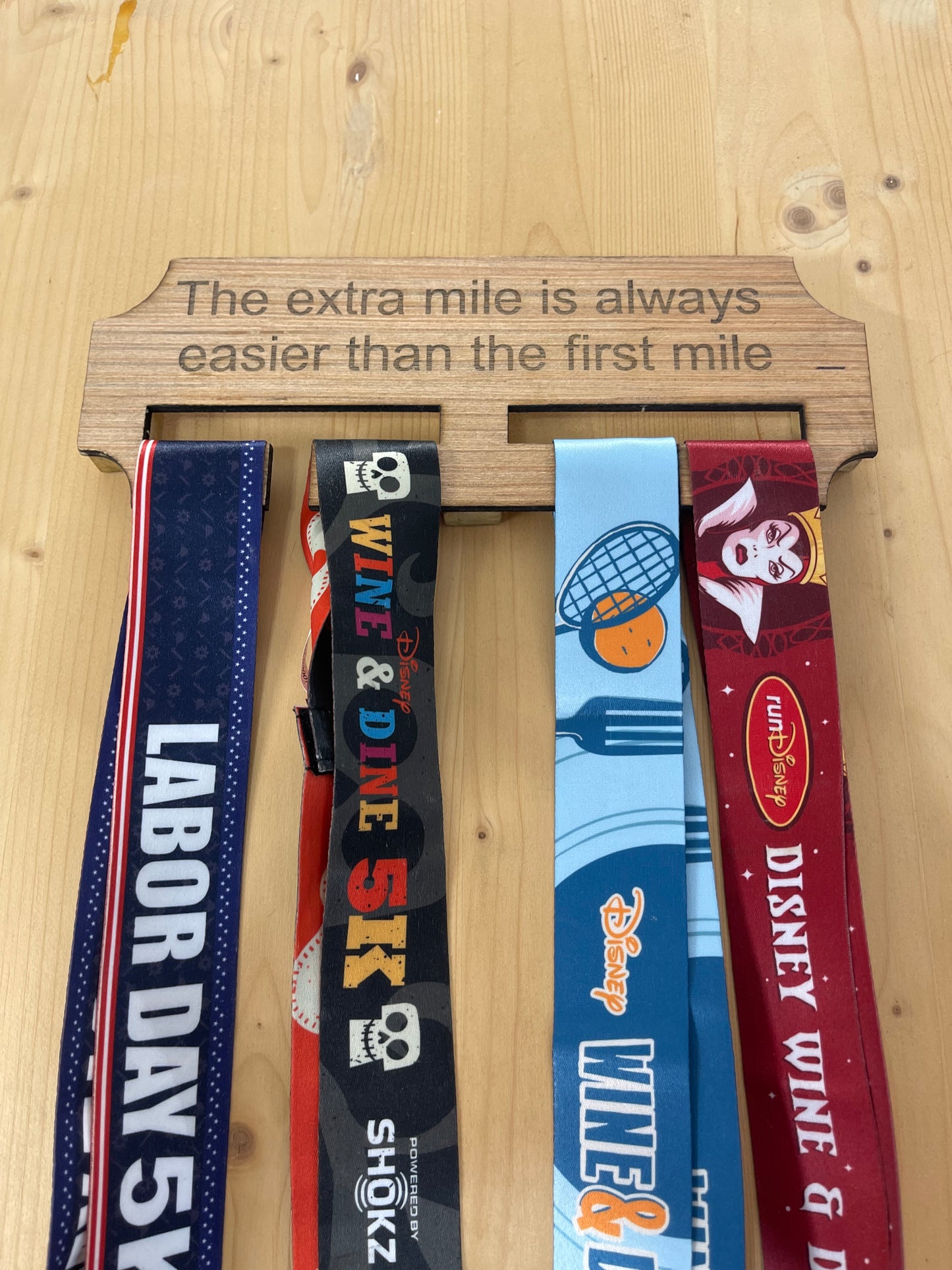 The extra mile wooden race medal hanger/holder