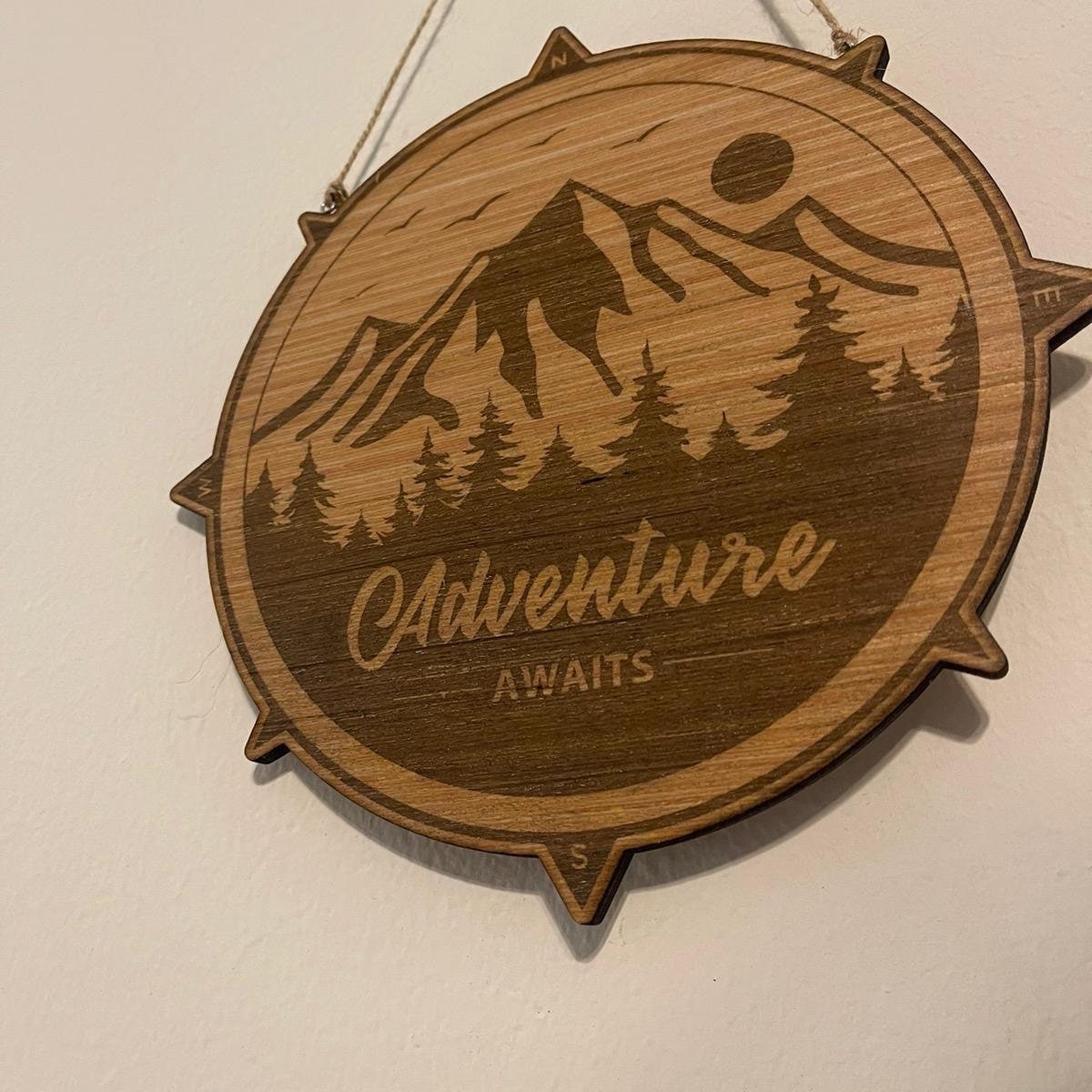 Adventure awaits outdoor enthusiasts sign