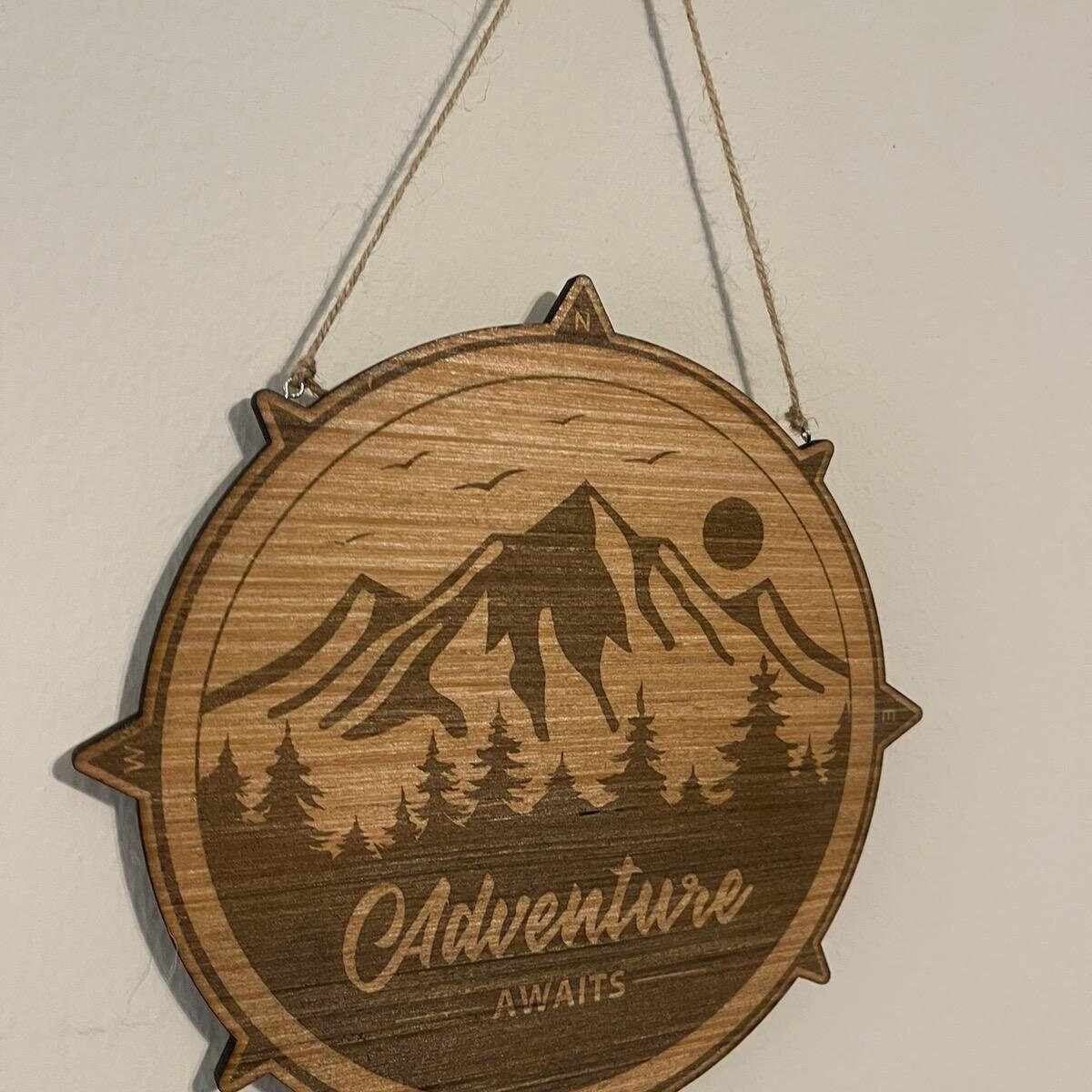 Adventure awaits outdoor enthusiasts sign